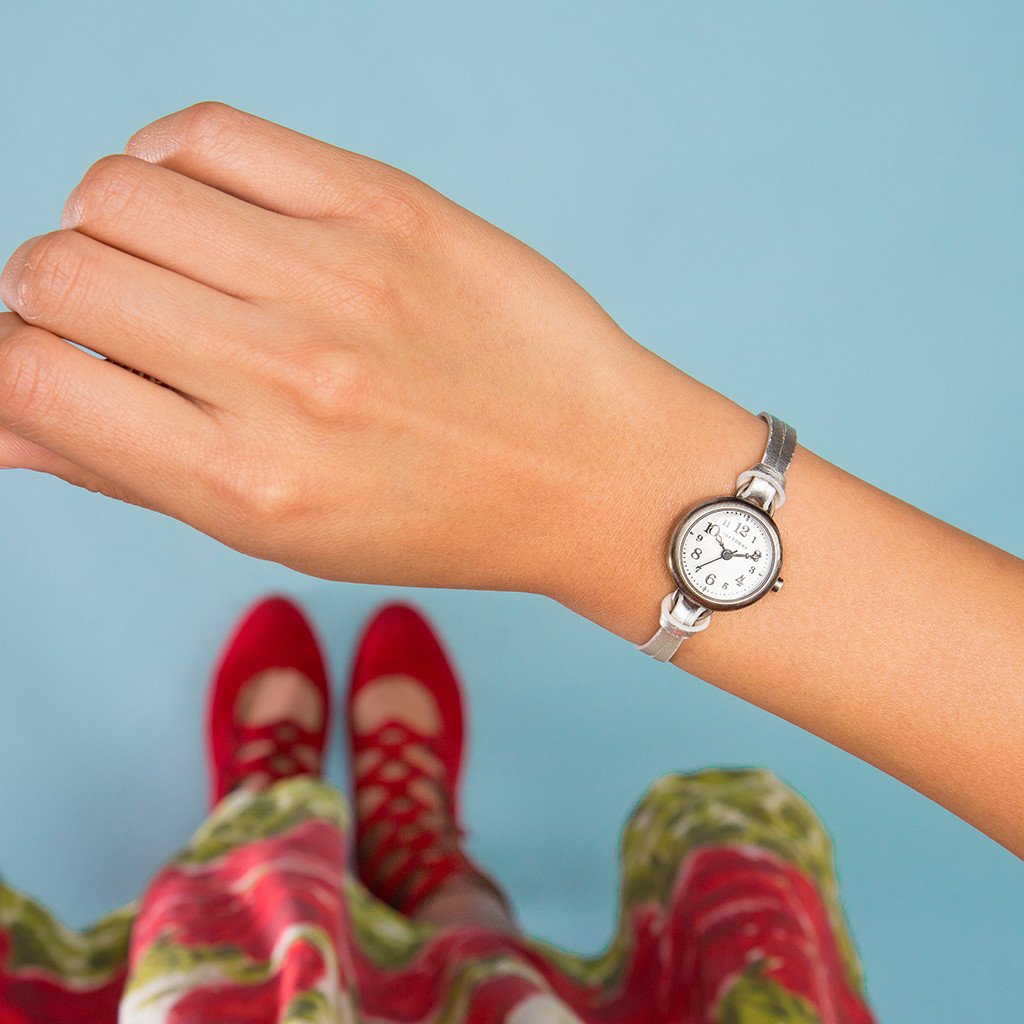 Eva Silver womens petite watch style by TOKYObay. Vintage inspired petite dial with thin leather buckle strap. Classic style watch for the everyday.
